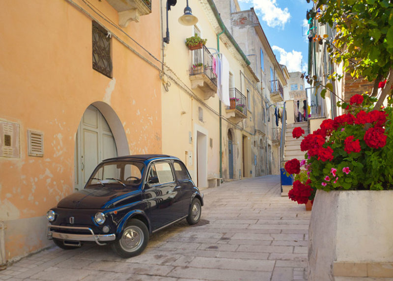 Street scene in an Italian village with Fiat 500