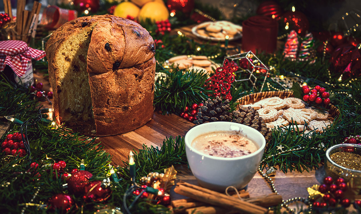 italian dolci panettone biscuits and hot chocolate for christmas on festive table