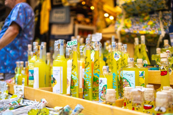 Bottles of Limoncello in the street market. Food from Amalfi Coast in Naples, Italy