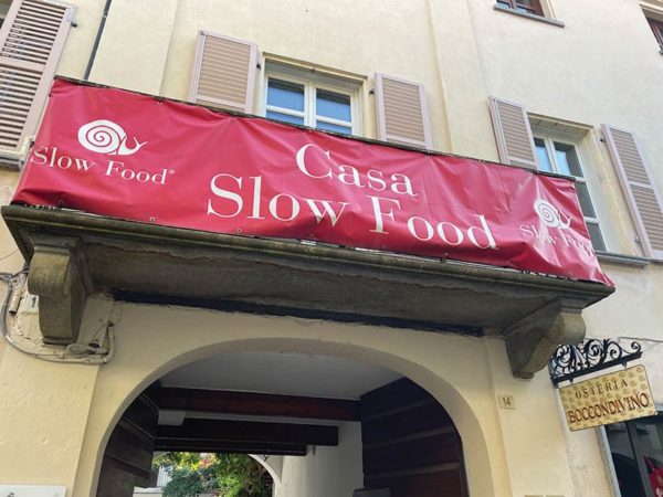 'Casa slow food' sign displaying snail logo