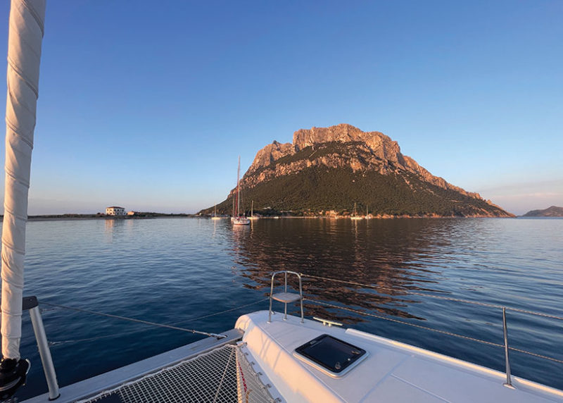 View of Tavolara Island from a sailboat